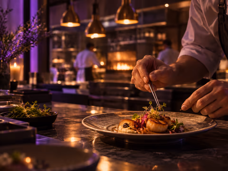 Chef plating a dish in an upscale restaurant